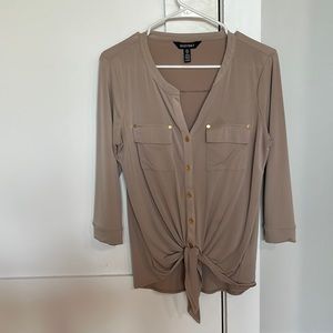 Cream button up shirt. Ties in front.